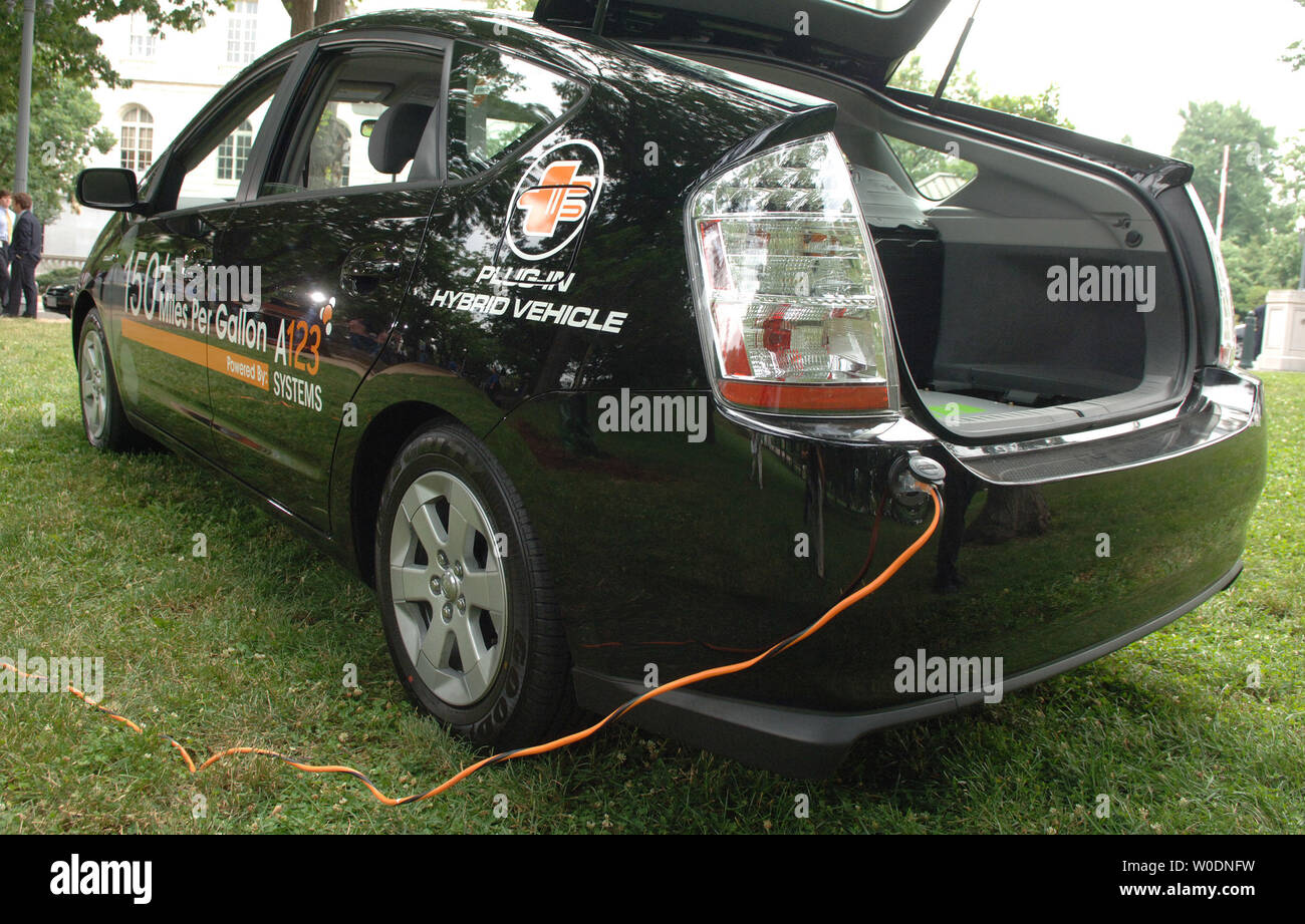 A plug is seen connected into a Toyota Prius plug-in hybrid at a  demonstration on new energy technologies aimed at improving Americas energy  efficiency, on Capitol Hill in Washington on June 20,