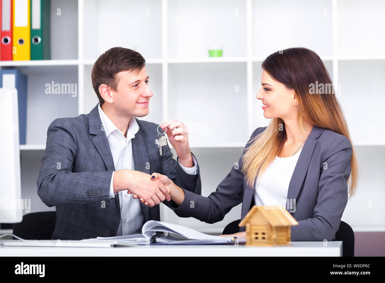 Sales manager giving advice to his couple clients Stock Photo - Alamy