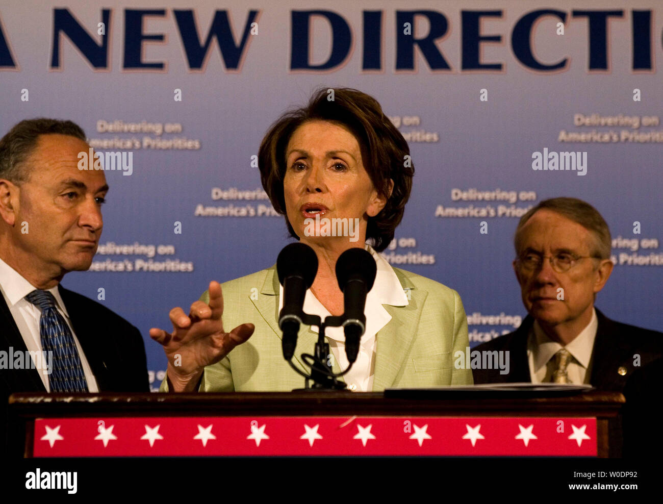 Speaker of the House Nancy Pelosi (D-CA) discusses the legislative accomplishments of and obstacles to the new Democratic Congress over the past six months, as Se. Charles Schumer (D-NY) and Senate Majority Leader Harry Reid (D-NV) look on, at Capitol Hill in Washington on June 29, 2007.     (UPI Photo/David Brody) Stock Photo