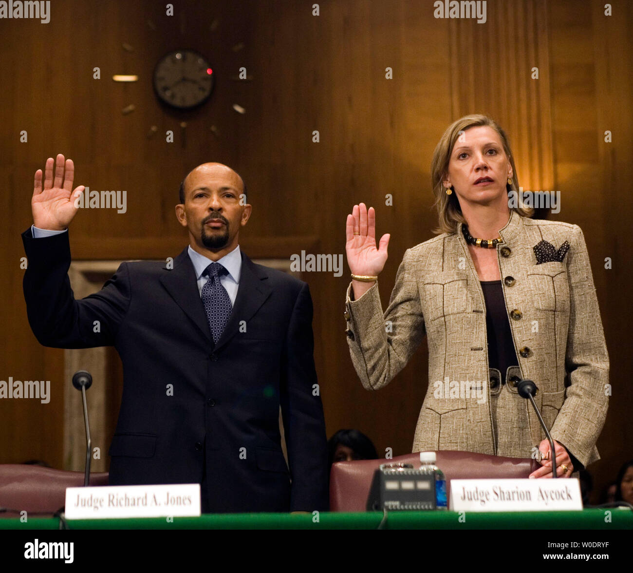 Richard Jones (L), nominee to be U.S. District Judge for the Western District of Washington, and Sharion Aycock, nominee to be U.S. District Judge for the Northern District of Mississippi, are sworn in before the Senate Judiciary Committee at a confirmation hearing on Capitol Hill in Washington on July 19, 2007.   (UPI Photo/David Brody) Stock Photo