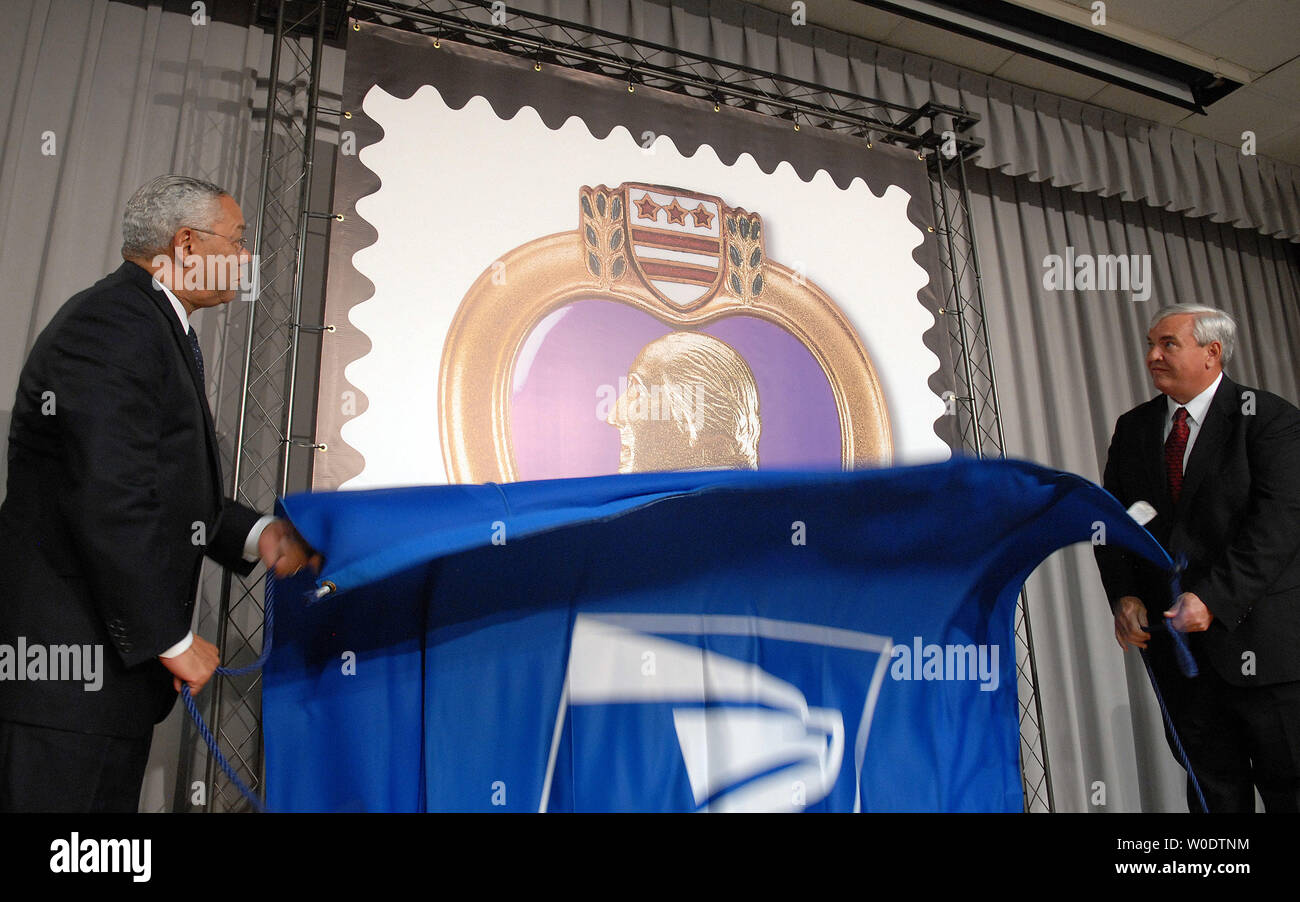 Former Secretary of State Colin Powell (L) and U.S. Postmaster General