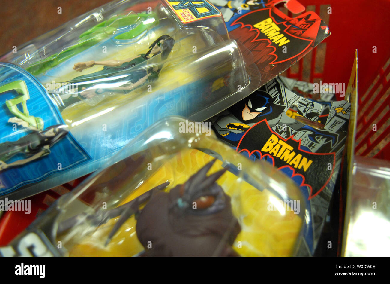 Batman action figures are seen in a basket at Kinder Haus Toy store in Arlington, Virginia on August 14, 2007. Mattel recalled 9 million Chinese made toys, including Polly Pocket play sets, Batman action figures, Fisher-Price toys and some die cast cars because of the presence of lead paint or their use of tiny magnets that could cause a choking hazard. This comes after Cheung Shu-hung, co-owner of A Lee Der Chinese Toy manufacturers, committed suicide at a warehouse following a Chinese ban. (UPI Photo/Kevin Dietsch) Stock Photo