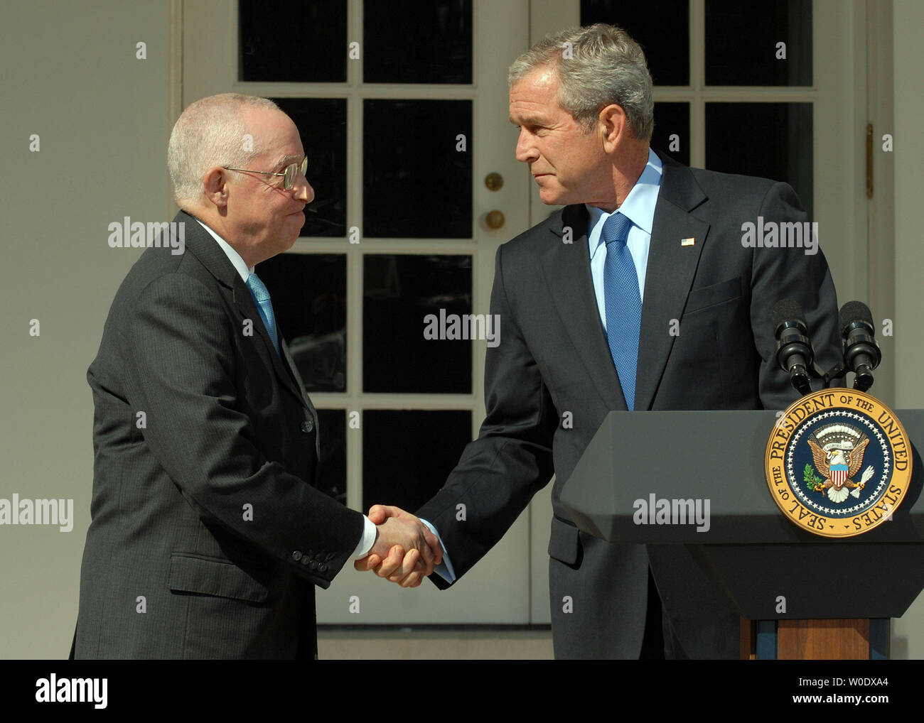 U.S. President George W. Bush (R) shakes hands with Michael B. Mukasey, a retired federal judge from New York, whom Bush nominated to replace Alberto Gonzales as attorney general in the Rose Garden of the White House on September 17, 2007.   (UPI Photo/Roger L. Wollenberg) Stock Photo