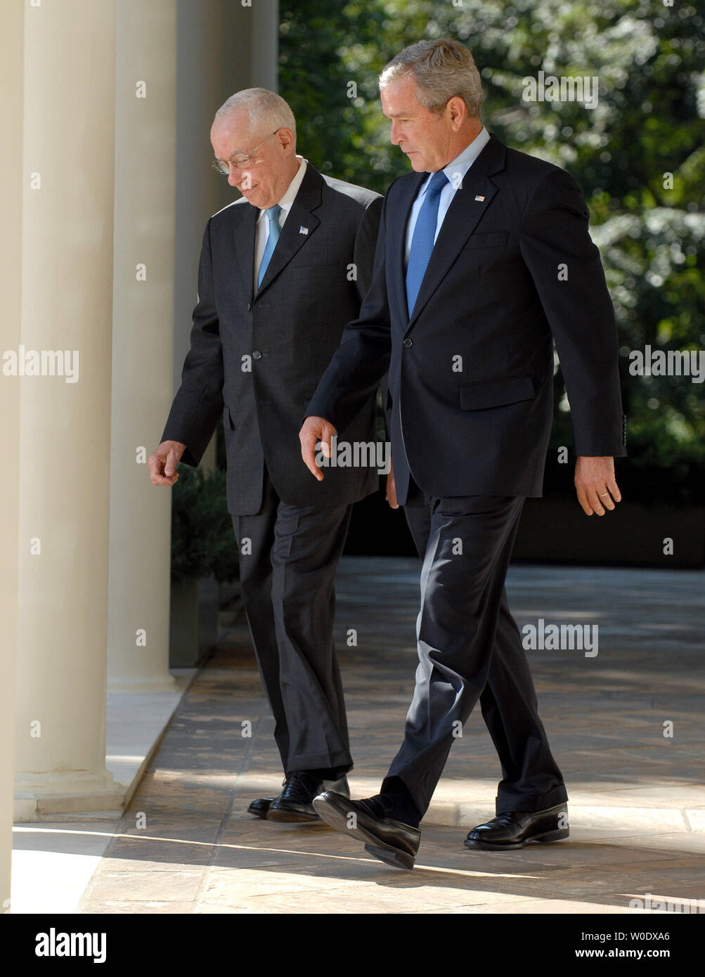 U.S. President George W. Bush (R) walks with Michael B. Mukasey, a retired federal judge from New York, through the Colonnade of the Rose Garden at the White House  on September 17, 2007. Bush announced Mukasey as his nominee to replace Alberto Gonzales as attorney general.   (UPI Photo/Roger L. Wollenberg) Stock Photo
