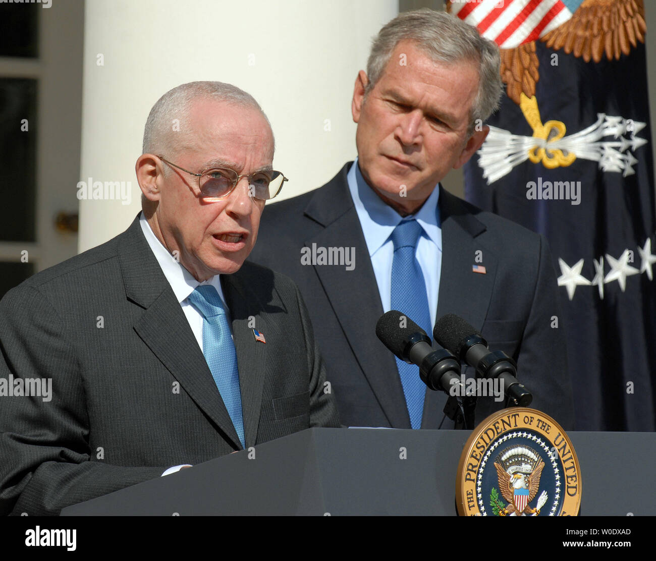 Michael B. Mukasey, a retired federal judge from New York, (L) speaks after U.S. President George W. Bush announced his nomination of Mukasey to replace Alberto Gonzales as attorney general in the Rose Garden of the White House on September 17, 2007.   (UPI Photo/Roger L. Wollenberg) Stock Photo