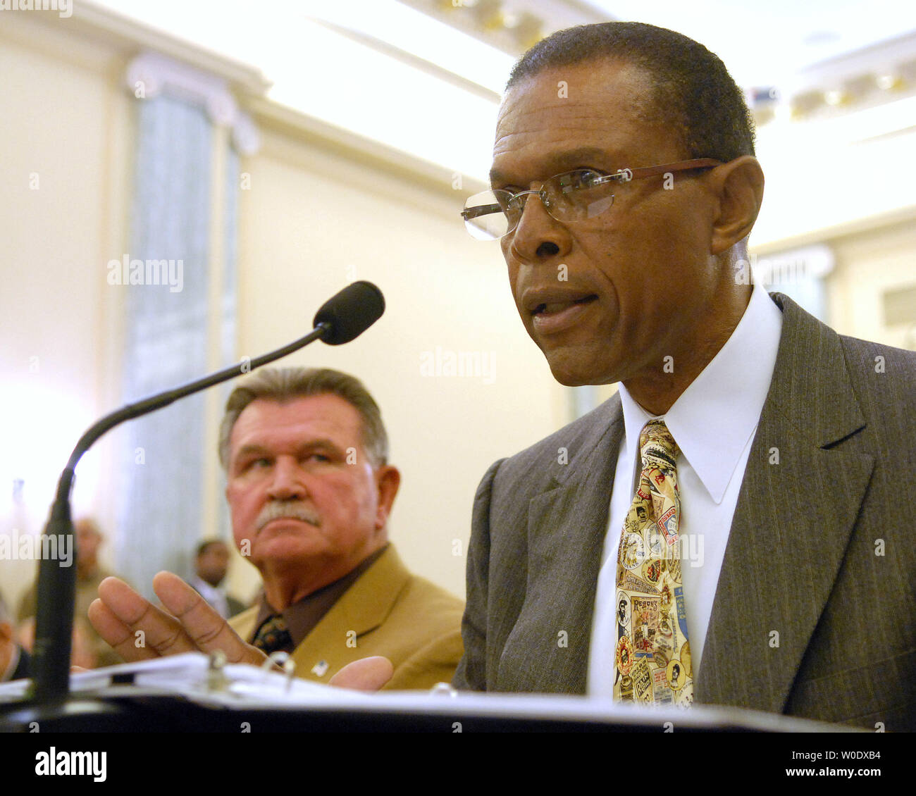 Former NFL player and coach Mike Ditka (L) listens as NFL Hall of Famer Gale Sayers (R) testifies about the NFL retirement and disability program before the Senate Committee on Commerce, Science and Transportation on Capitol Hill in Washington on September 18, 2007.   (UPI Photo/Roger L. Wollenberg) Stock Photo