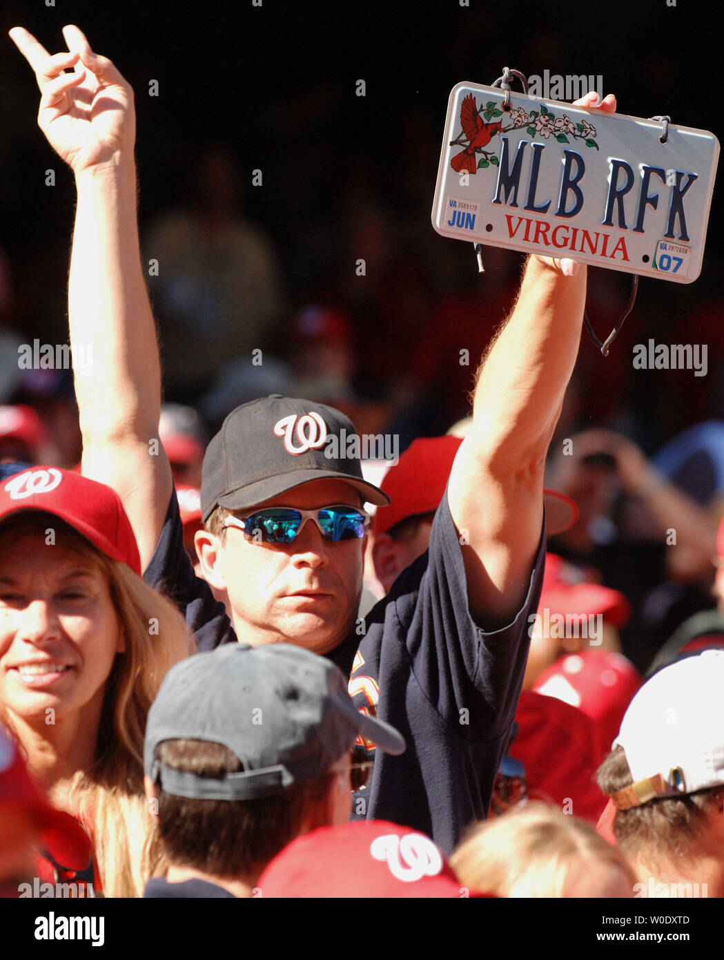 A fank holds a license plate reading MLB RFK after the Philadelphia ...