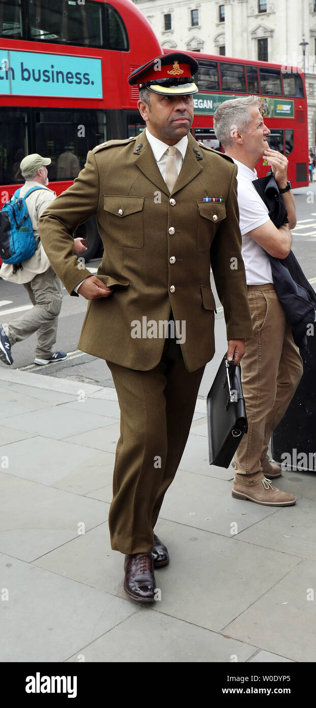 Pic shows: Dressed for battle? Boris Johnson supporter James Cleverly MP  arrives at the common in full uniform and was later seen playing with a  tenn Stock Photo - Alamy