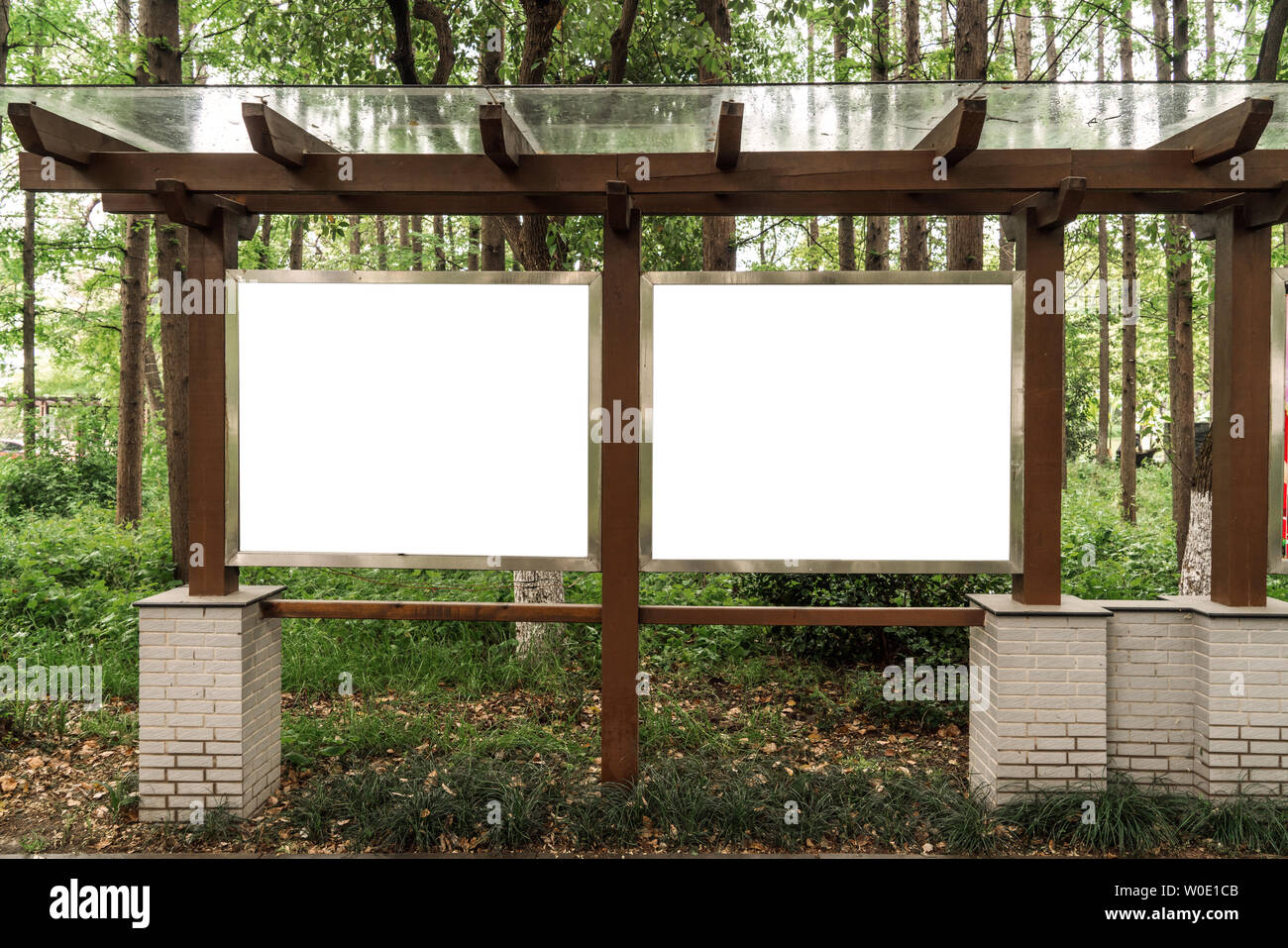 Billboards in the woods Stock Photo - Alamy