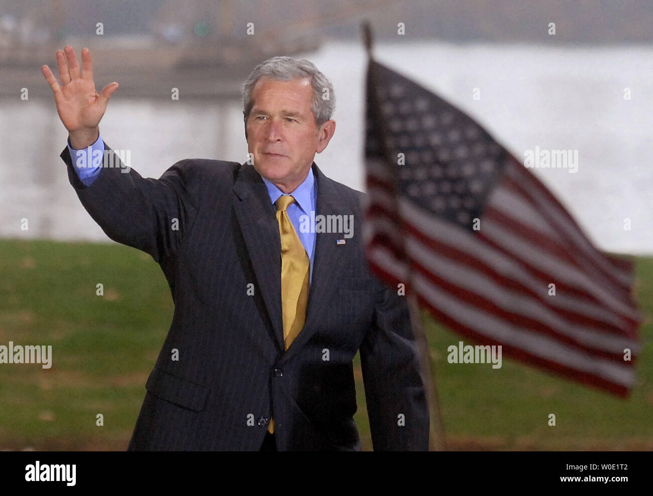 U.S. President George W. Bush waves to the crowd as he makes his way to ...