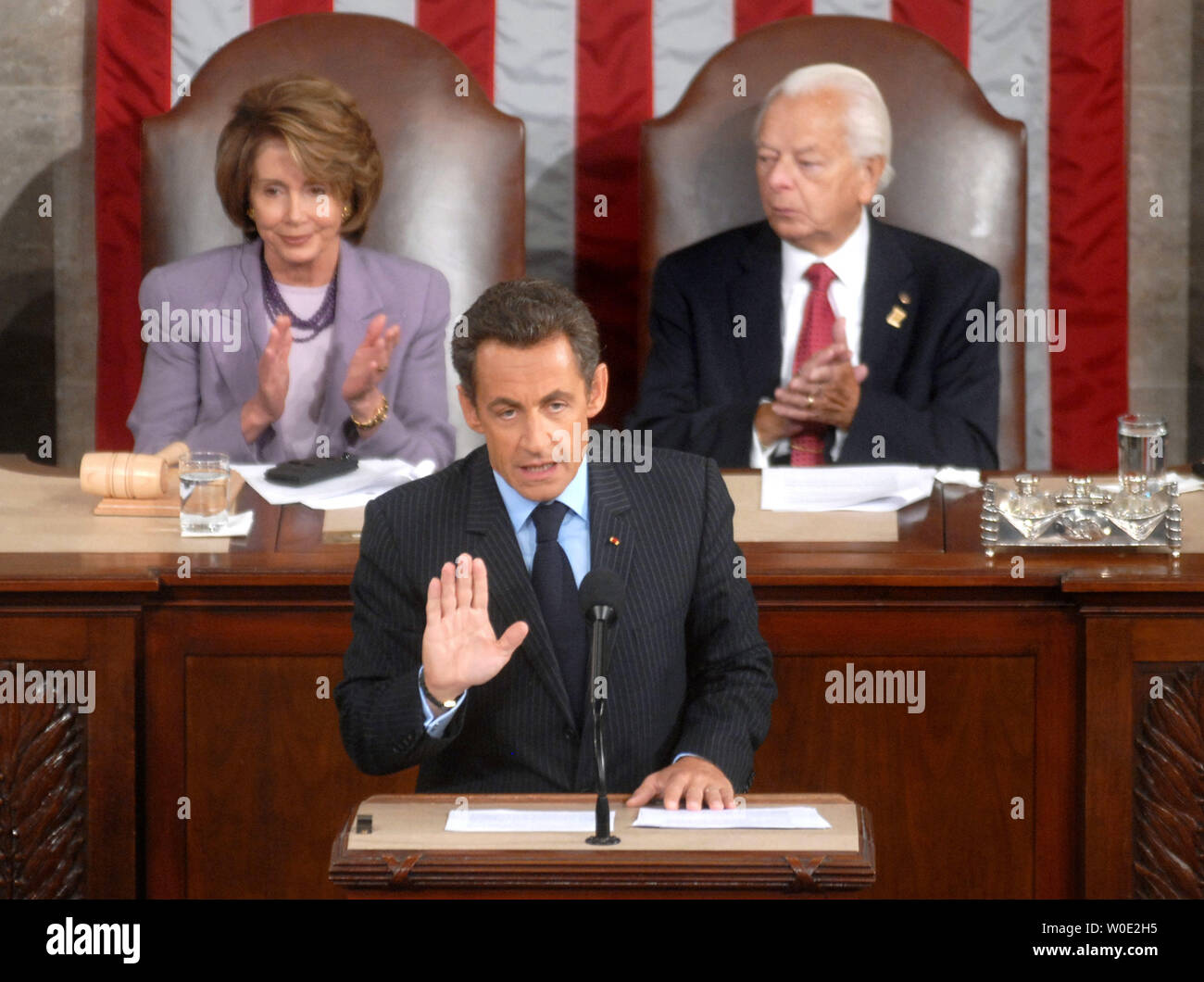 French President Nicolas Sarkozy addresses a joint meeting of Congress at the Capitol Building in Washington on November 7, 2007. House Majority Leader Nancy Pelosi and Senate President Pro Tempore Sen. Robert Byrd (D-WV) watched on. (UPI Photo/Kevin Dietsch) Stock Photo