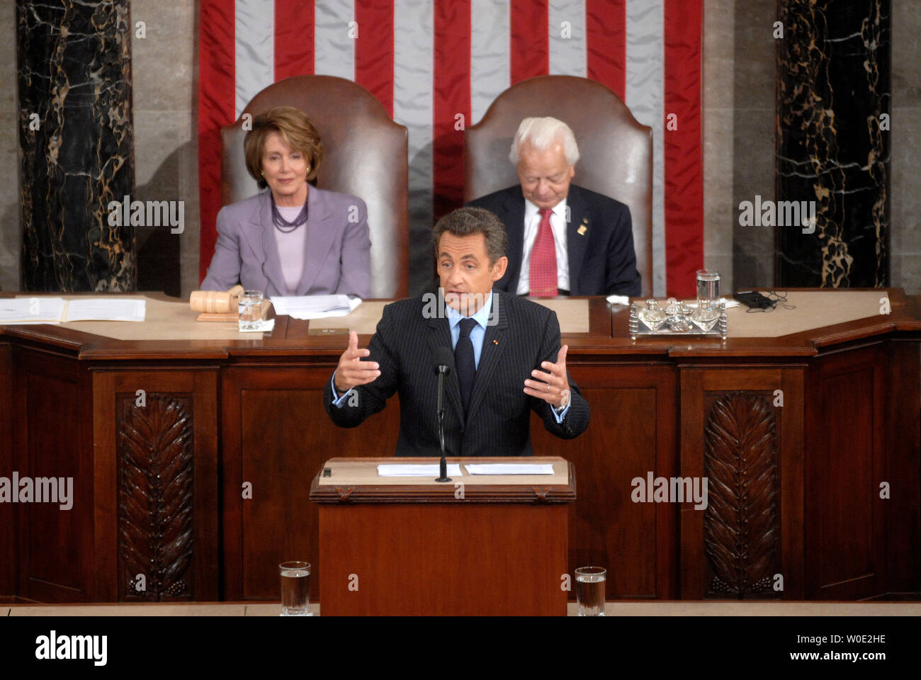 French President Nicolas Sarkozy addresses a joint meeting of Congress at the Capitol Building in Washington on November 7, 2007. Speaker of the House Nancy Pelosi and Senate President Pro Tempore Robert Byrd (D-WV) watched on. (UPI Photo/Kevin Dietsch) Stock Photo