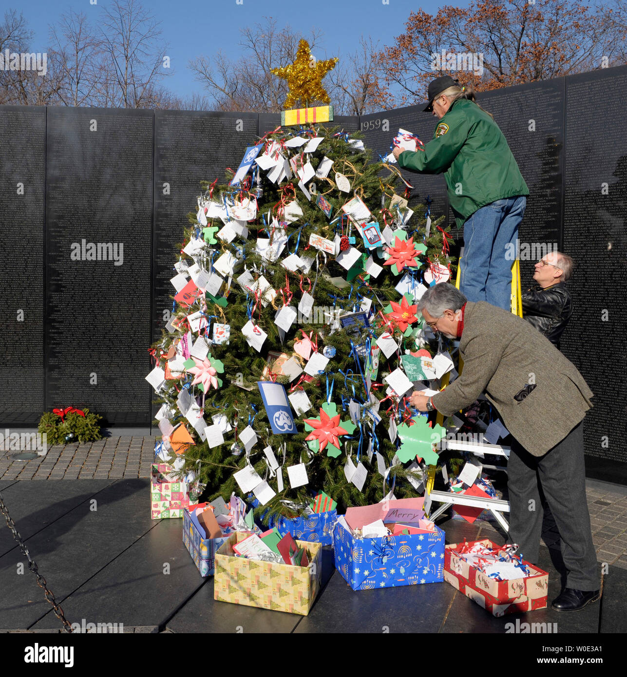 Volunteers help to decorate a Christmas tree at the Vietnam Veterans