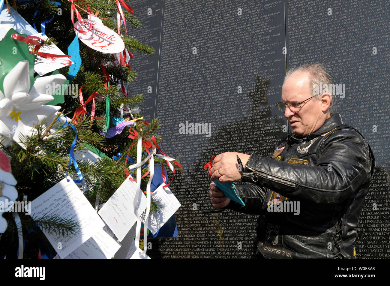 Mike Akins, 62, of Woodbridge, Virginia, helps to decorate a Christmas