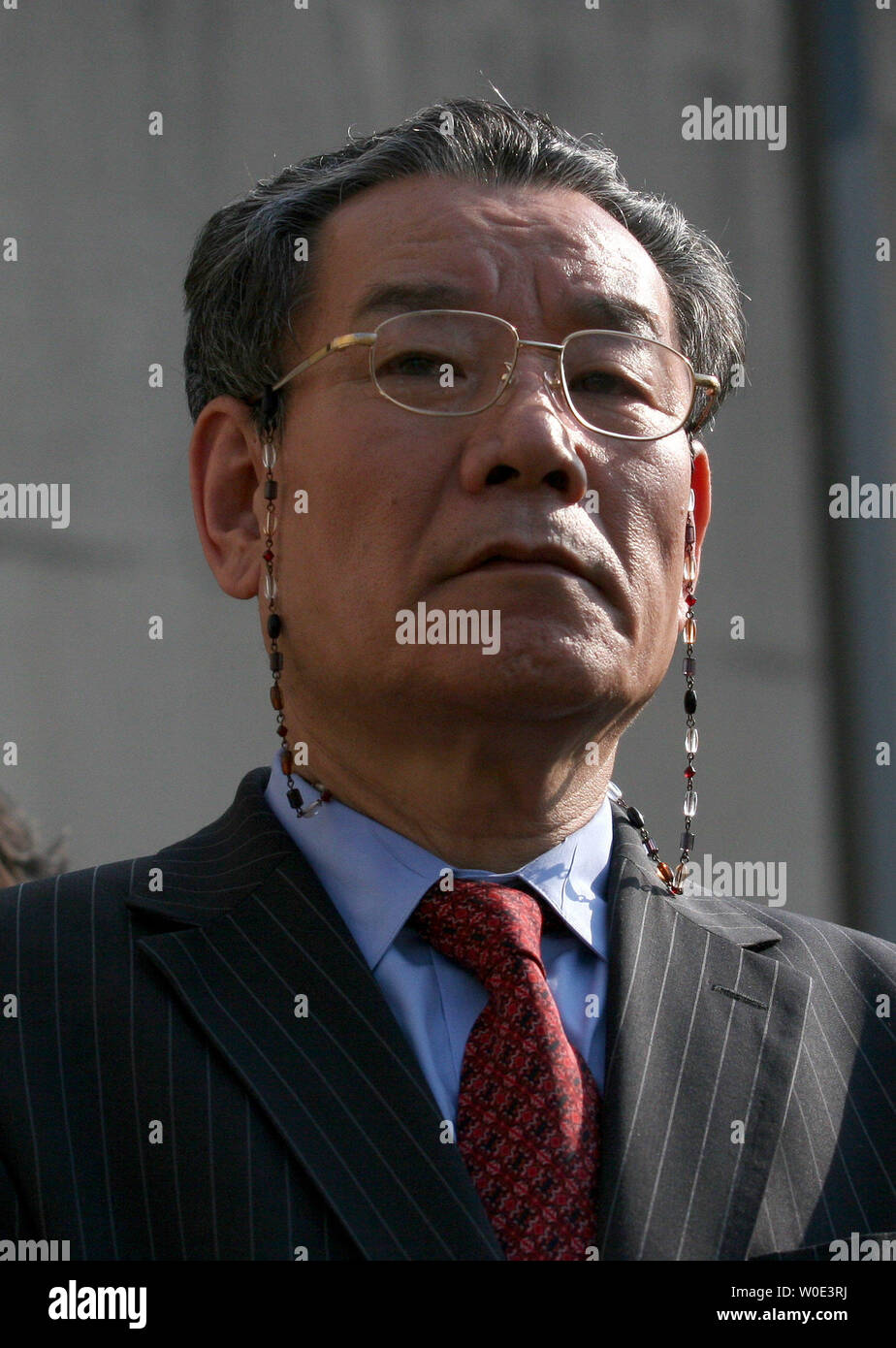 Jin Chung leaves the D.C. Superior Courthouse in Washington on June 13, 2007. Mr. Pierson, the plaintiff and D.C. judge, filed the suit after he claims, the Chung family lost his pants in their dry cleaning store. The family's attorney said that they were pleased with the way the case was going.  (UPI Photo/Dominic Bracco II) Stock Photo