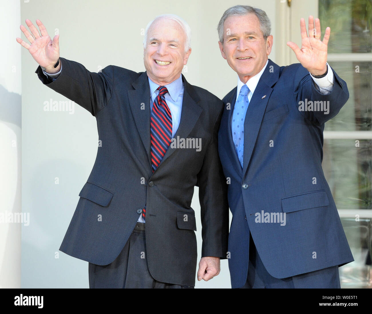 U.S. President George W. Bush and Republican presumptive presidential nominee Sen. John McCain (R-AZ) wave as they depart after speaking to the media in the Rose Garden of the White House on March 5, 2008. Bush endorsed McCain's candidacy and pledged to support McCain during the campaign.    (UPI Photo/Roger L. Wollenberg) Stock Photo