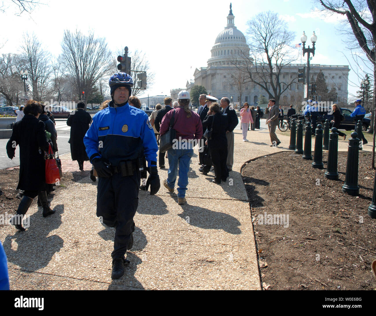 A U.S. Capitol Police officer directs people after the U.S. Capitol ...