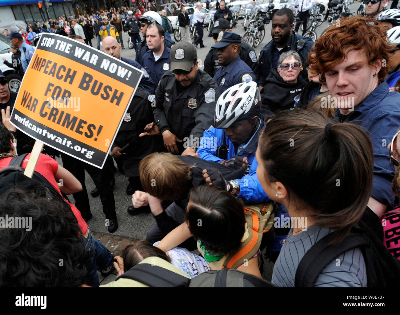 Anti-Iraq war protester clashes with police officers Washington on March 19, 2008.  Protesters took to the streets today across the Nation and in Washington to protest the 5th Anniversary of the U.S. invasion of Iraq. (UPI Photo/Kevin Dietsch) Stock Photo