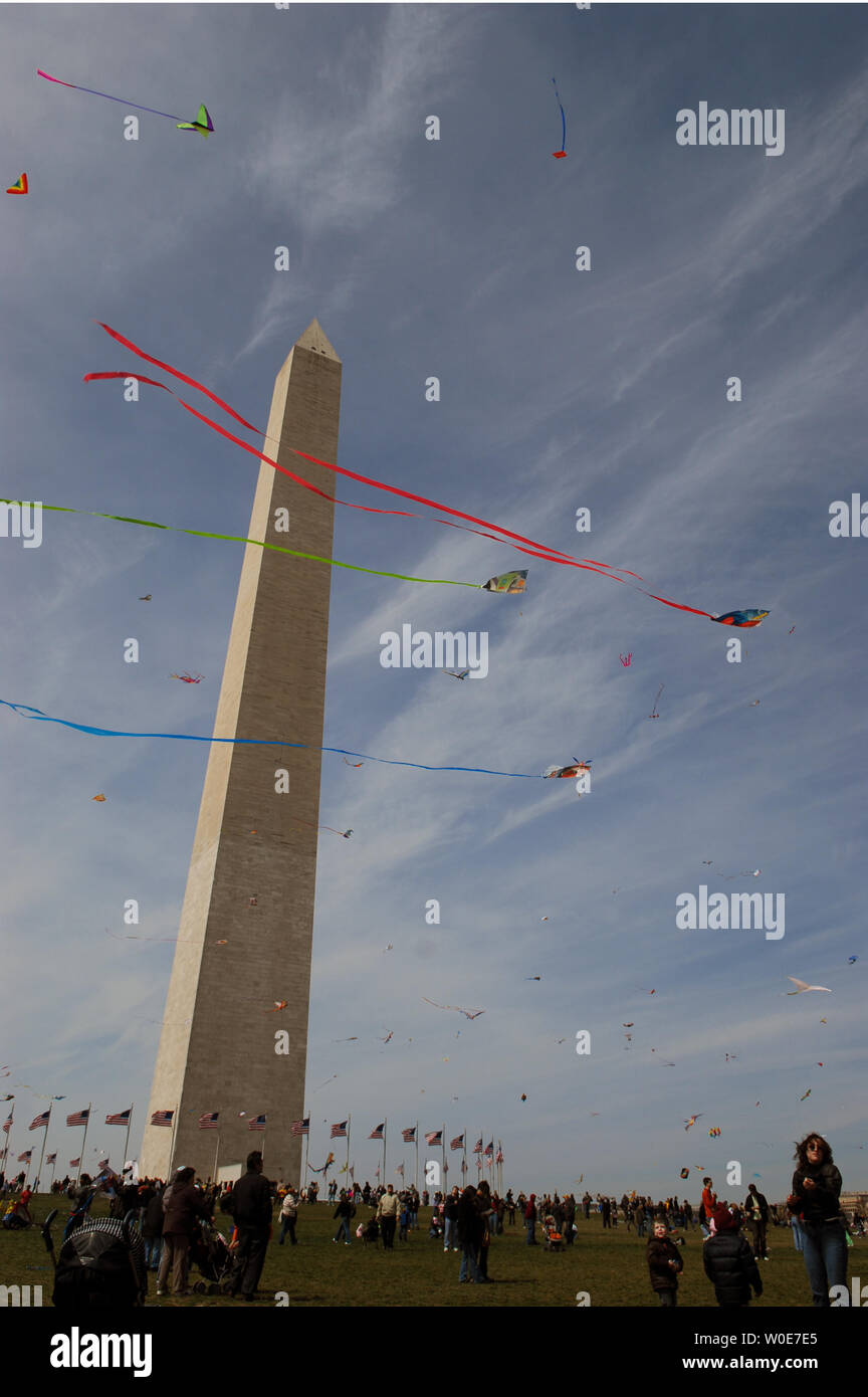 Kites soar by the Washington Monument during the annual kite festival