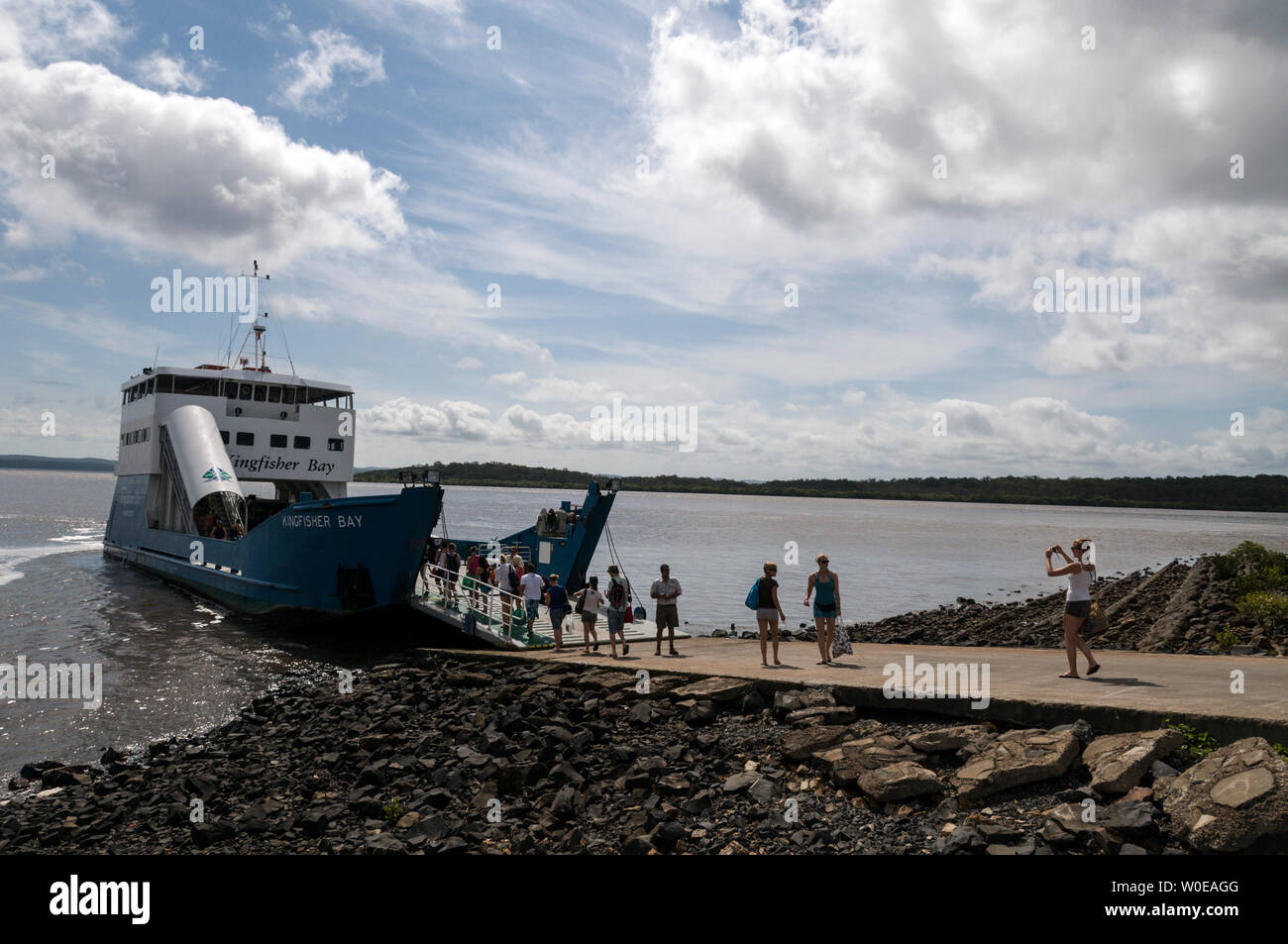 Foot passengers boarding  the Kingfisher Bay car ferry at River Heads south of Hervey Bay for Fraser Island in southern Queensland, Australia. Stock Photo