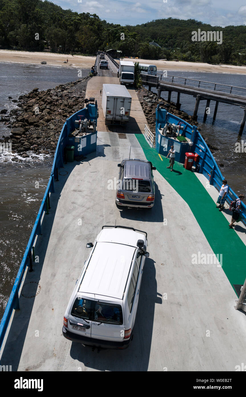 Vehicles prepare to disembark from the car ferry at Kingfisher Bay resort on Fraser Island after a one hour crossing from River Heads south of Hervey Stock Photo