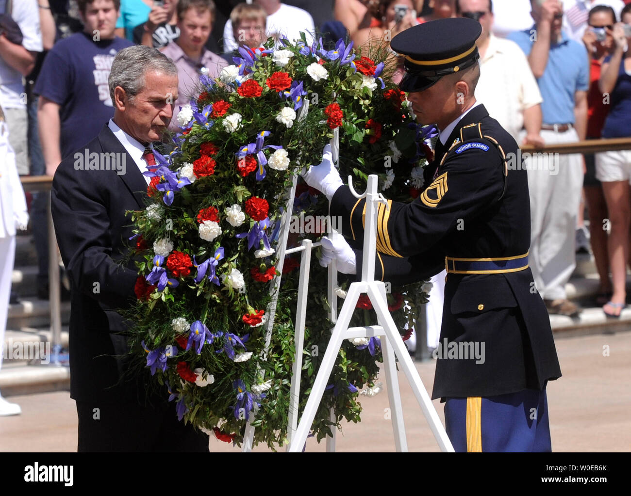 U.S. President George W. Bush (L) and a member of the Army Honor Guard participate in a wreath laying ceremony at the Tomb of the Unknown Soldiers at Arlington National Cemetary on Memorial Day, May 26, 2008 in Arlington, Virginia. (UPI Photo/Kevin Dietsch) Stock Photo