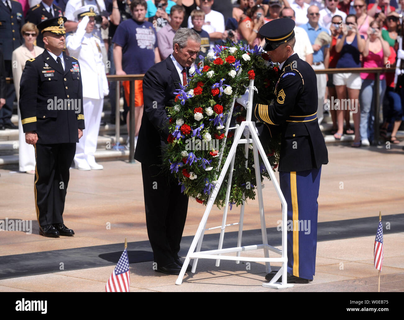 U.S. President George W. Bush (C), Gen. Richard J. Rowe Jr. (L) and a member of the Army Honor Guard participate in a wreath laying ceremony at the Tomb of the Unknown Soldiers at Arlington National Cemetary on Memorial Day, May 26, 2008 in Arlington, Virginia. (UPI Photo/Kevin Dietsch) Stock Photo