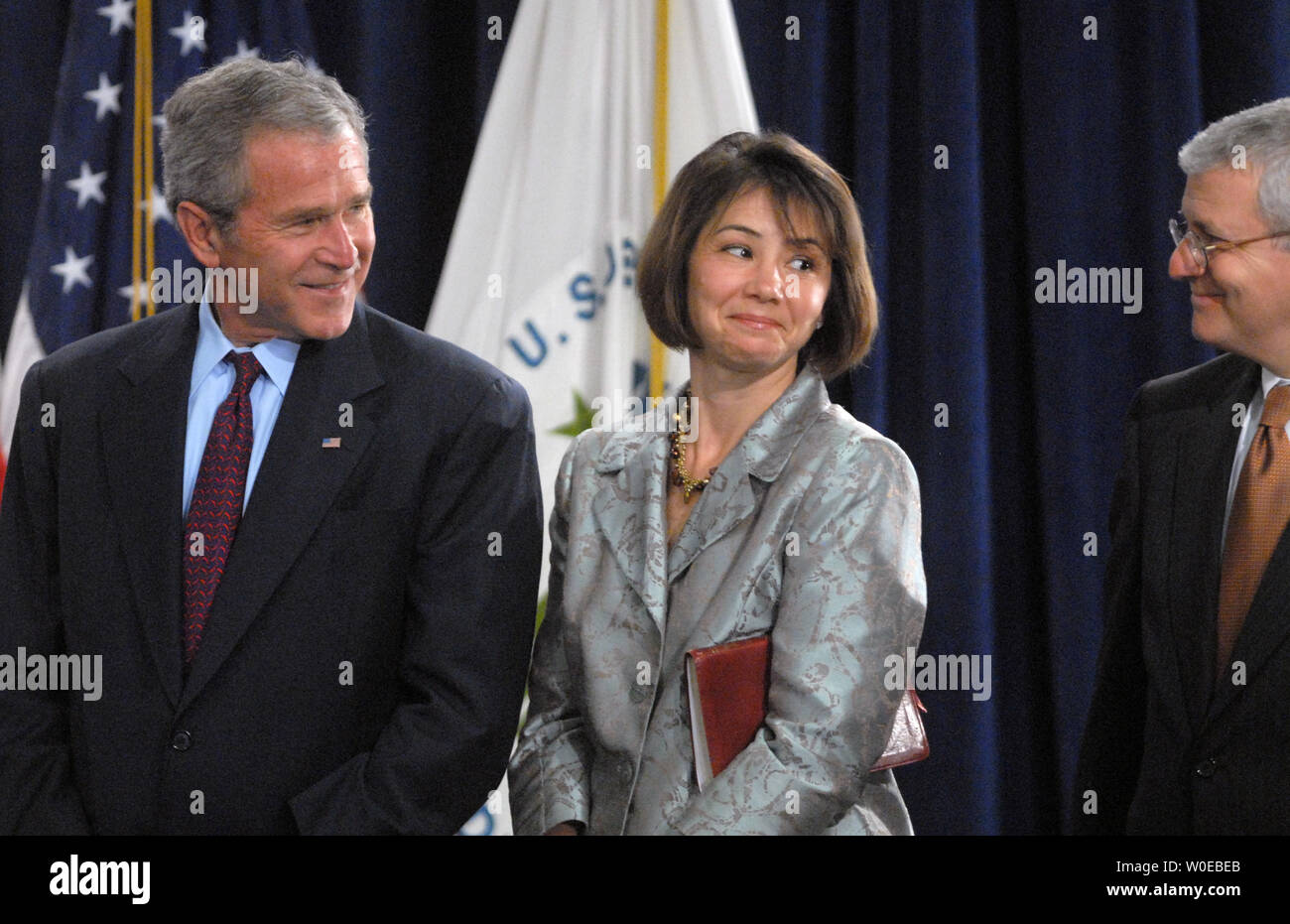 u-s-president-george-w-bush-speaks-to-molly-preston-wife-of-steven-preston-new-director-of-u-s-department-of-housing-and-urban-development-and-white-house-chief-of-staff-josh-bolten