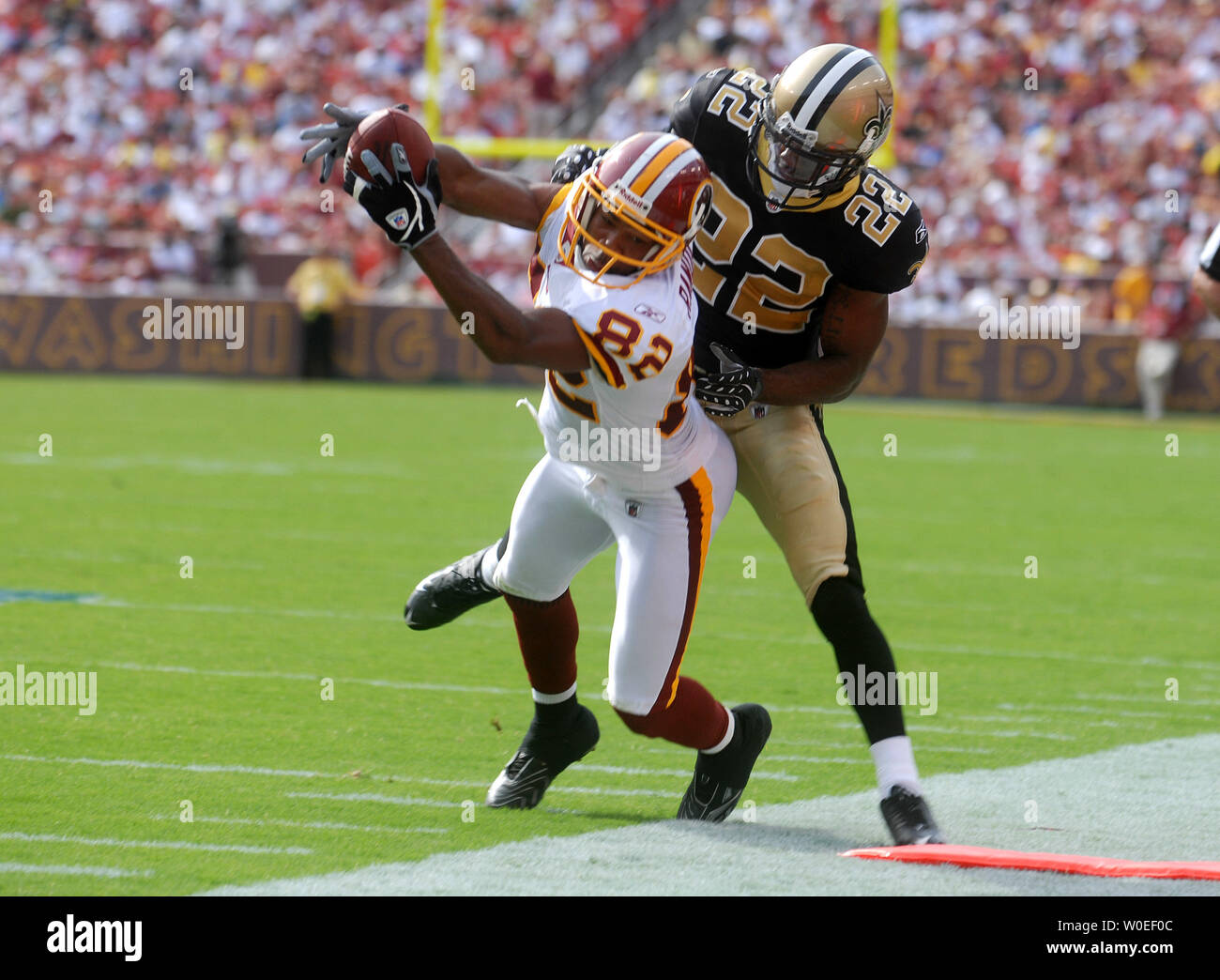 Washington Redskins' Antwaan Randle El brings in a first down reception against New Orleans Saints Tracy Porter during the fourth quarter at FedEx Field in Landover, Maryland on September 14, 2008. The Redskins defeated the Saints 29-24. (UPI Photo/Kevin Dietsch) Stock Photo