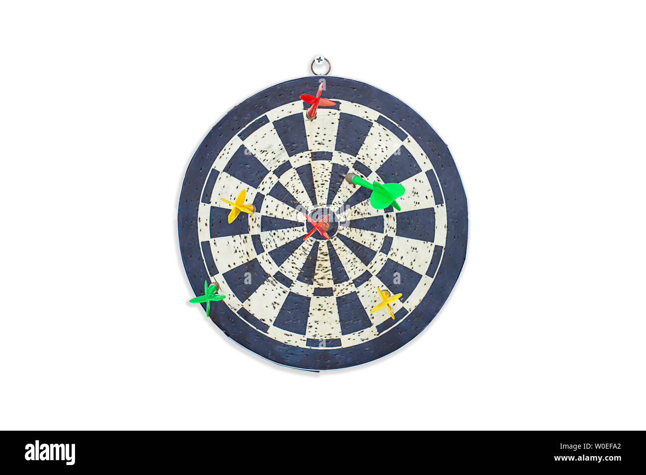Isolated Darts stuck on target on a white background with clipping path. Stock Photo