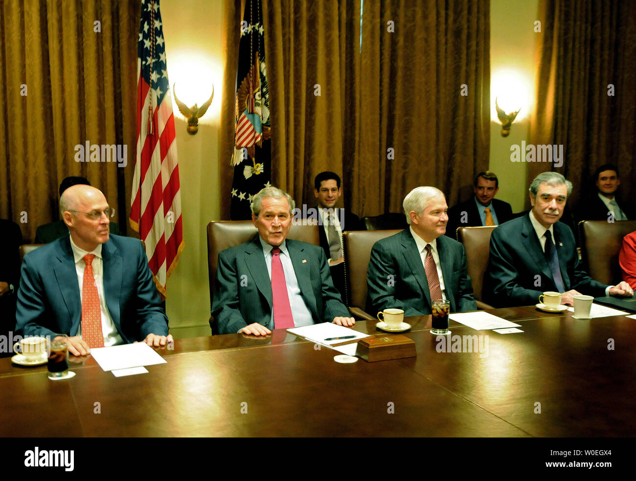 U S President George W Bush 2 L Sits Next To Treasury