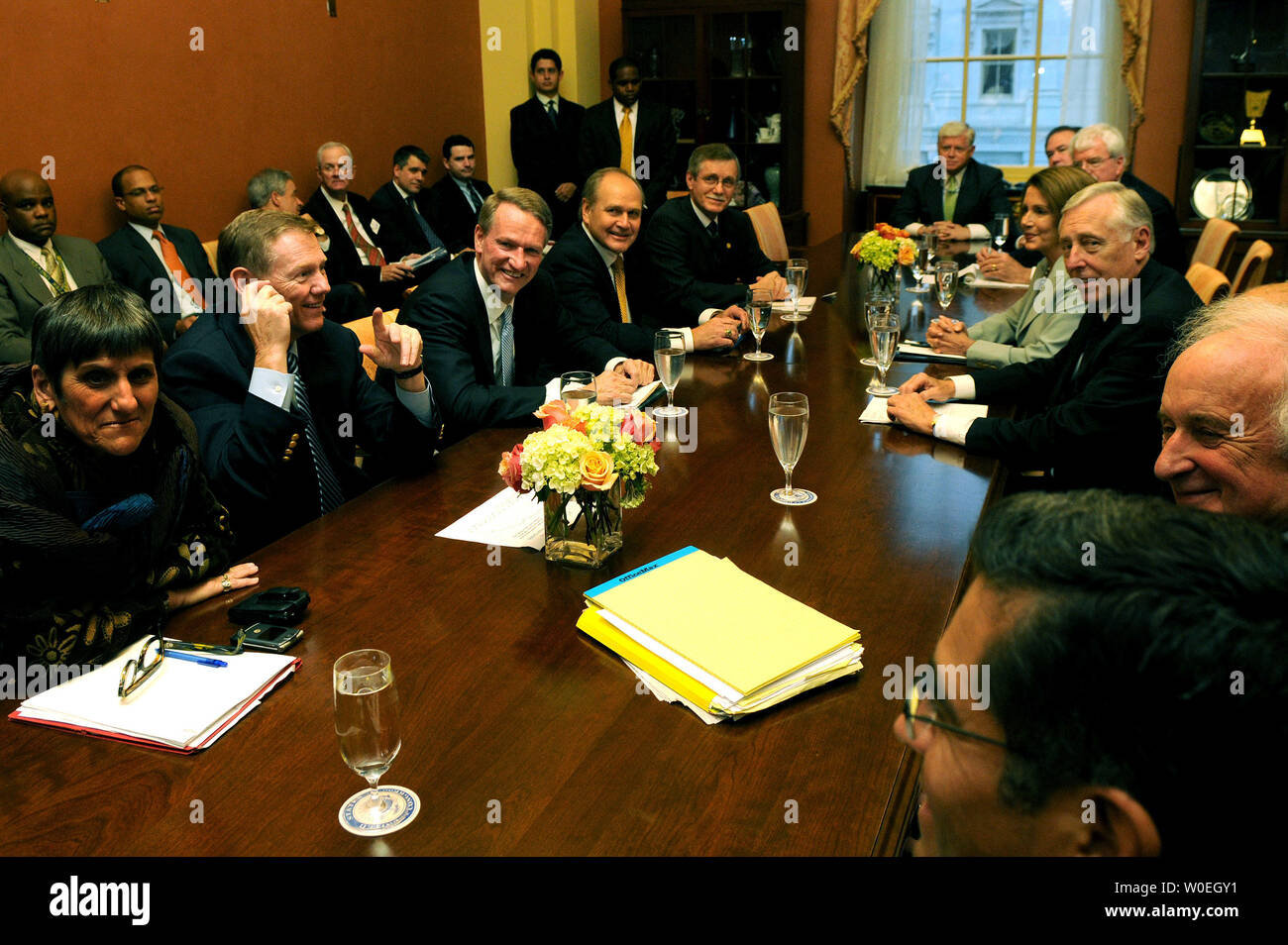 Speaker of the House Nancy Pelosi (D-CA) (4th-R), House Majority Leader Steny Hoyer (D-MD) (3rd-R) and other representatives meet with Alan Mulally (2nd-L), President and CEO of Ford Motor Co., Rick Wagoner (3rd-LL), CEO of General Motors Corp., Robert Nardelli (4th-L), Chairman and CEO of Chrysler LLC and Ron Gettelfinger (5th-L), President of the United Auto Workers Union, in her office on Capitol Hill in Washington on November 6, 2008. The automakers were discussing the possibility of a government bailout. (UPI Photo/Kevin Dietsch) Stock Photo