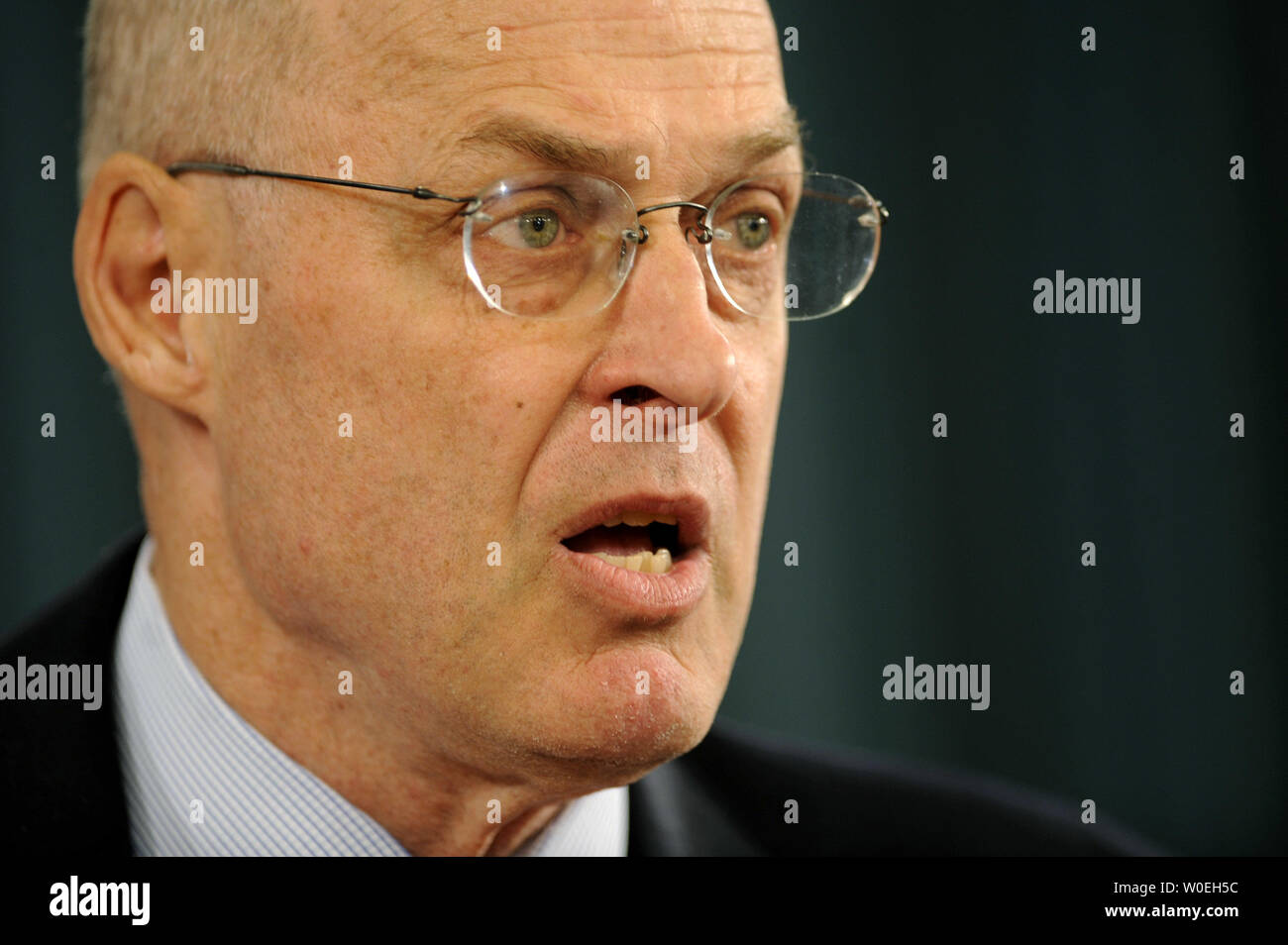 Treasury Secretary Henry Paulson delivers remarks on the economy and the financial rescue package at the Treasury Department in Washington on November 12, 2008. Paulson said the goal for plan would be to support financial markets which supply consumers credit, such as credit card debt, auto loans and student loans. (UPI Photo/Kevin Dietsch) Stock Photo