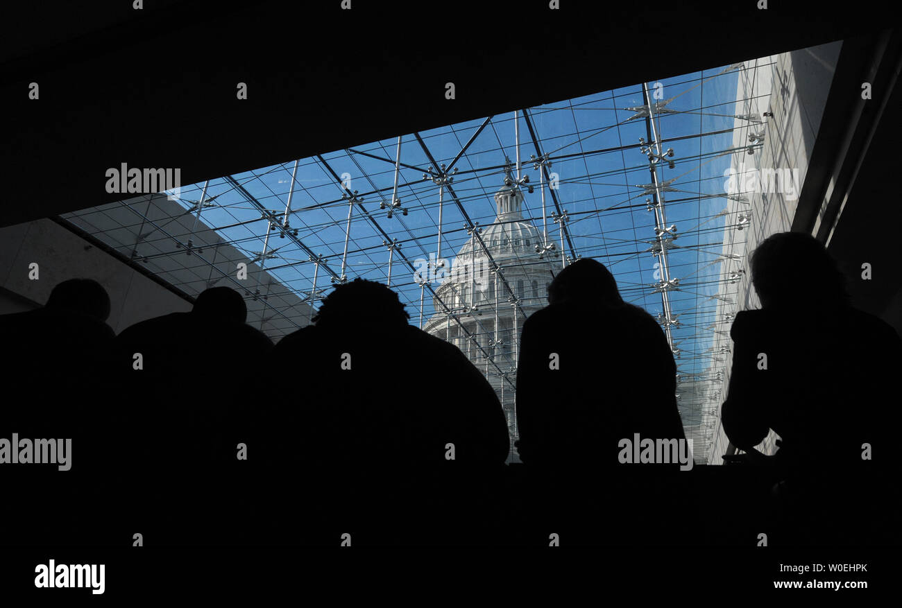 A View Of The Capitol Dome Is Seen Through A Glass Ceiling