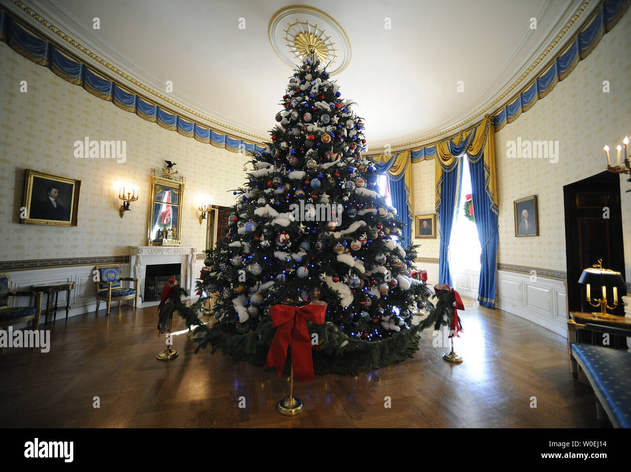 The 2008 White House Christmas tree is seen in the Blue Room of the White  House in Washington on December 3, 2008. The theme for this year's holiday  decorations in "A Red,
