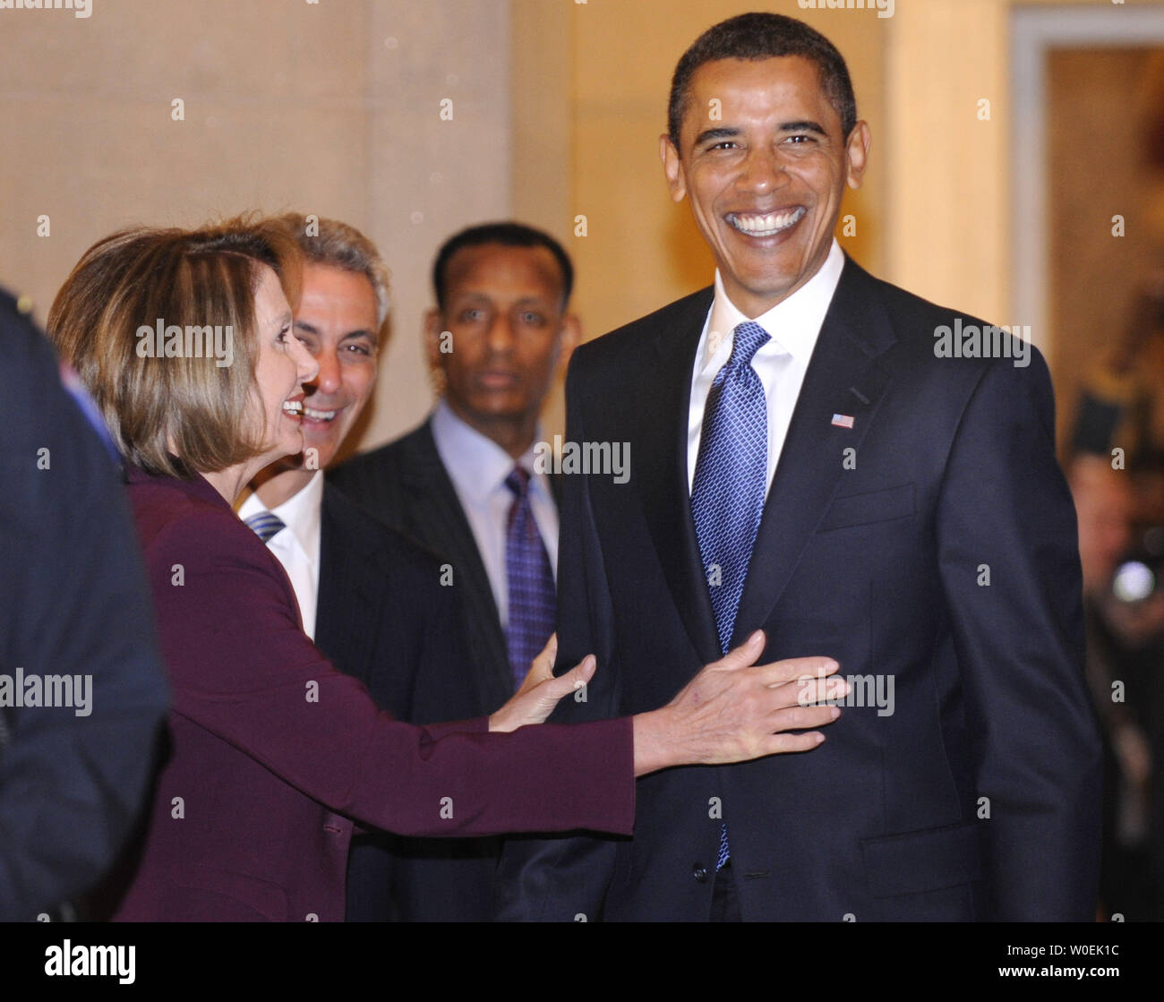 President-elect Barack Obama jokes with Speaker of the House Nancy Pelosi (D-CA) after a meeting in the U.S. Capitol Building in Washington on January 5, 2008. (UPI Photo/Kevin Dietsch) Stock Photo