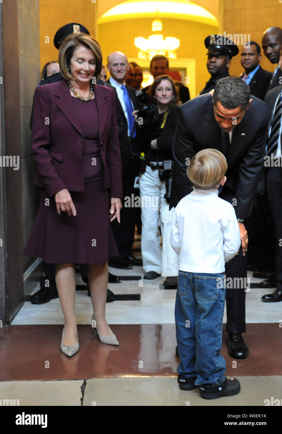 President-elect Barack Obama greets Carl Metz, a young visitor at the Capitol Building, after a meeting with Speaker of the House Nancy Pelosi (D-CA) (L) in Washington on January 5, 2008. (UPI Photo/Kevin Dietsch) Stock Photo