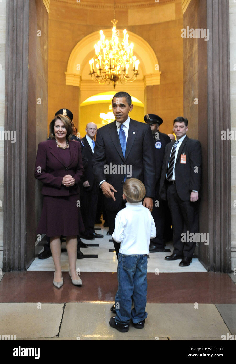 President-elect Barack Obama greets Carl Metz, a young visitor at the Capitol Building, after a meeting with Speaker of the House Nancy Pelosi (D-CA) (L) in Washington on January 5, 2008. (UPI Photo/Kevin Dietsch) Stock Photo