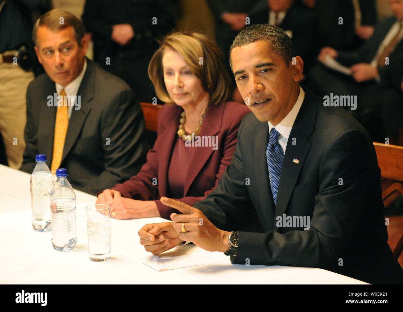 President-elect Barack Obama (R) delivers remarks alongside Speaker of the House Nancy Pelosi (D-CA) (C) and House Minority Leader John Boehner (R-OH) during a meeting with Congressional leaders on Capitol Hill in Washington on January 5, 2008. (UPI Photo/Kevin Dietsch) Stock Photo