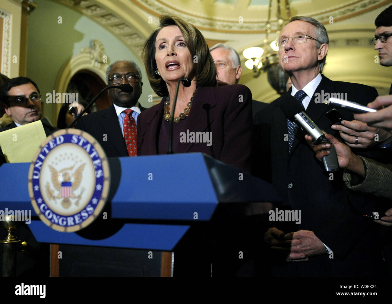 Speaker of the House Nancy Pelosi (D-CA) and Senate Majority Leader Harry Reid (D-NV) speak to the press following a meeting with President-elect Barack Obama on Capitol Hill in Washington on January 5, 2008. (UPI Photo/Kevin Dietsch) Stock Photo