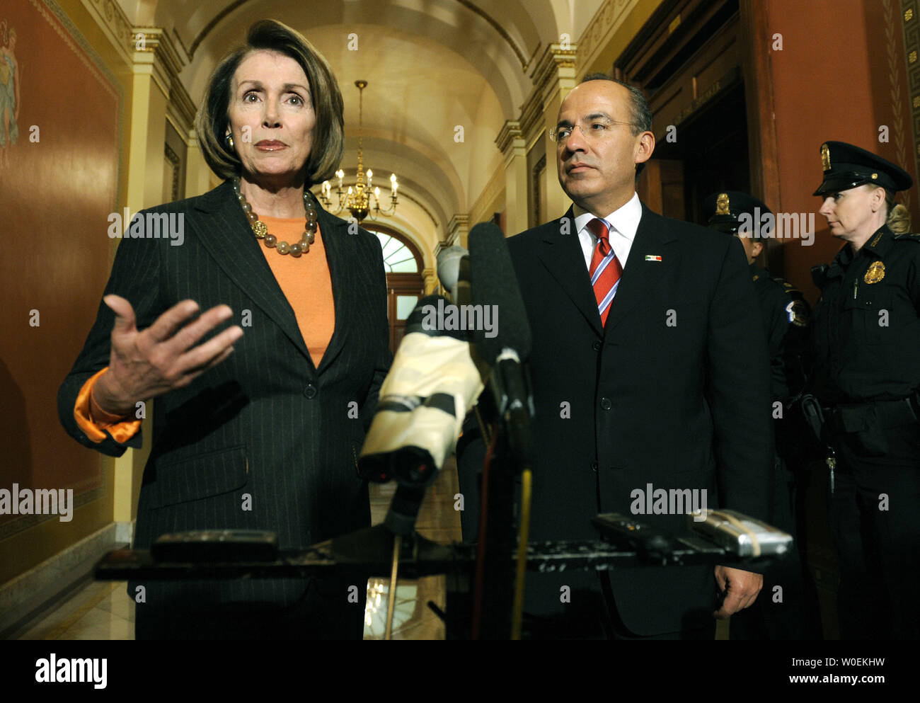 Speaker of the House Nancy Pelosi (L) and Mexican President Felipe Calderon address members of the media prior to a meeting on Capitol Hill in Washington on January 12, 2008. (UPI Photo/Kevin Dietsch) Stock Photo