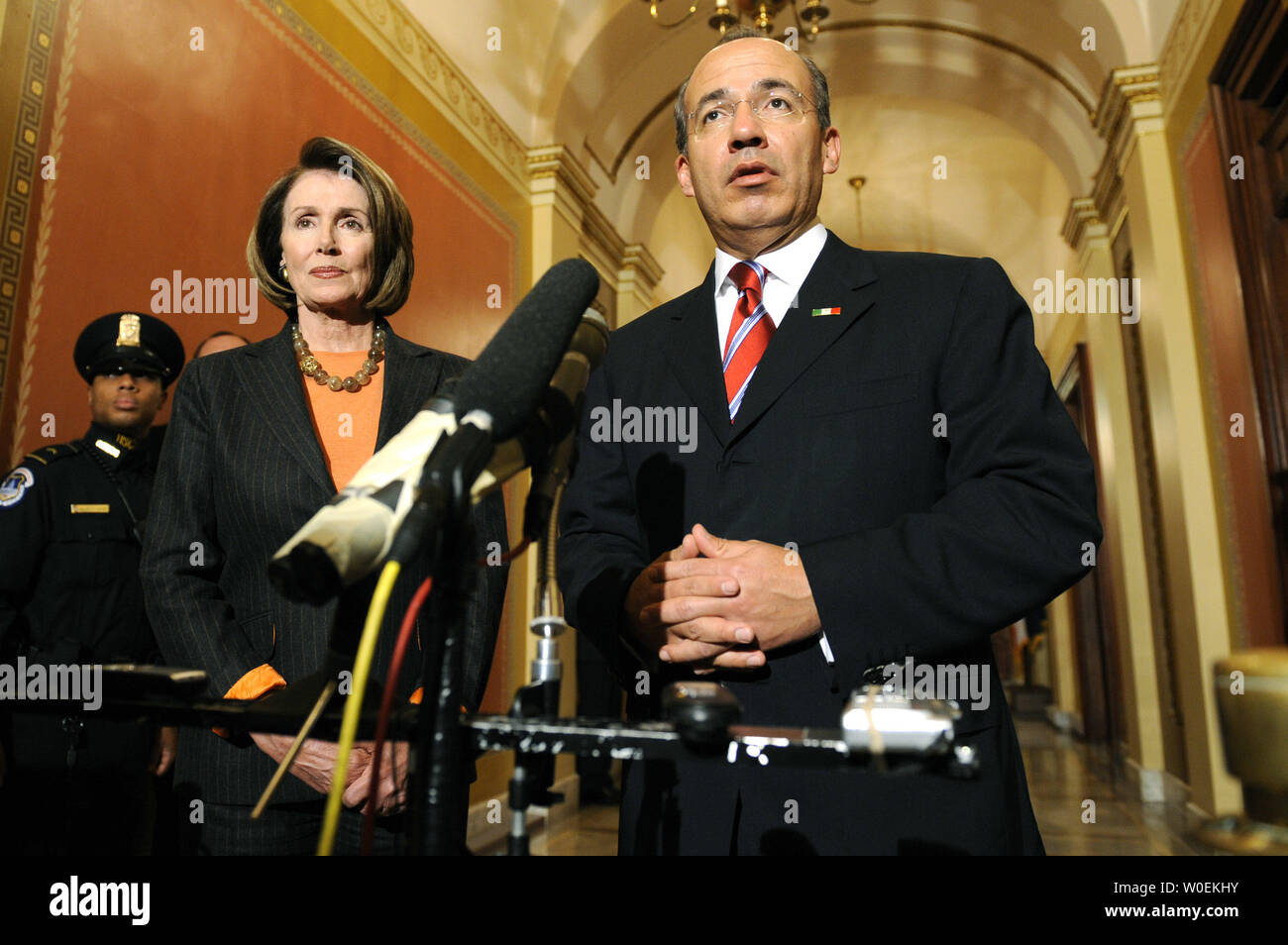 Mexican President Felipe Calderon (R) and Speaker of the House Nancy Pelosi address members of the media prior to a meeting on Capitol Hill in Washington on January 12, 2008. (UPI Photo/Kevin Dietsch) Stock Photo