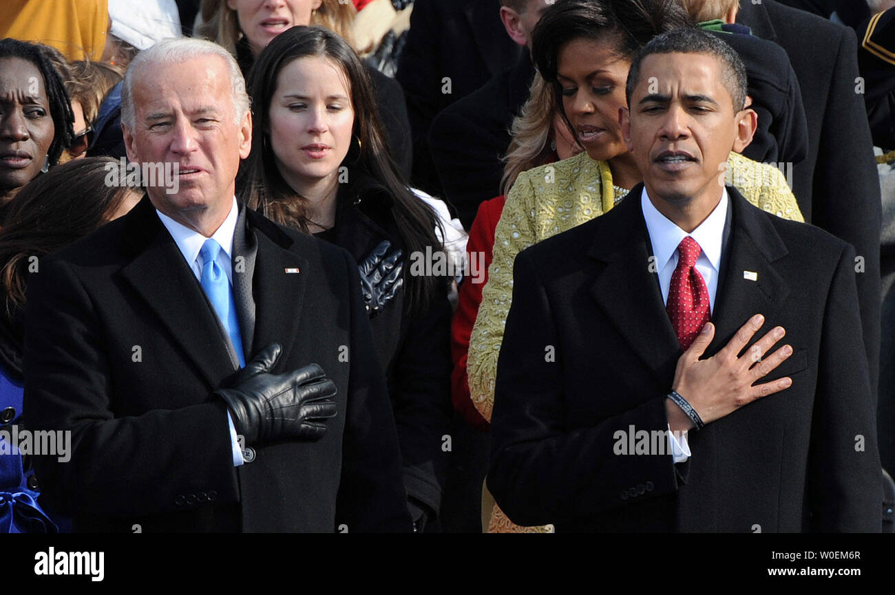President Barack Obama (L) and vice-president Joe Biden sing the national anthem after Obama was sworn in as the 44th President of the United States on the west steps of the Capitol on January 20, 2009.    (UPI Photo/Pat Benic) Stock Photo