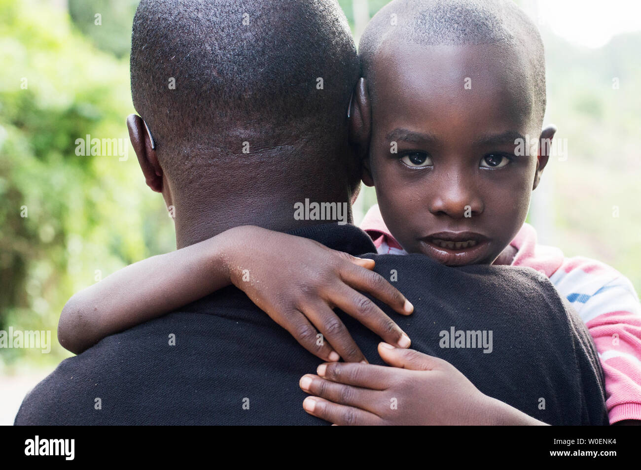 Dad hugs his children against him because he is proud of him Stock Photo