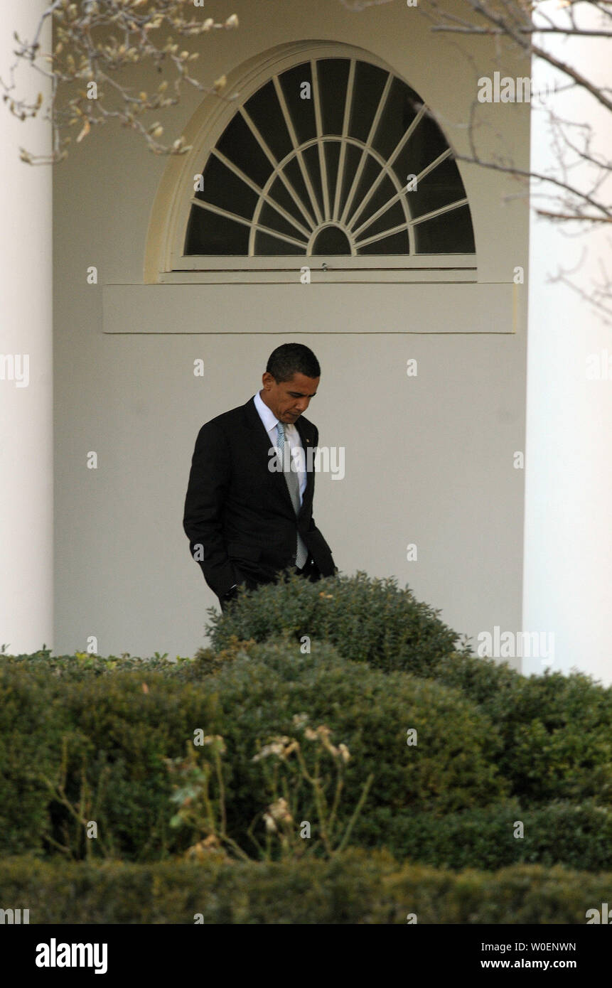 U.S. President Barack Obama walks through the colonnade of the Rose Garden at the White House as he makes his way to join his family on Marine One en route to Chicago for the Presidents' Day weekend on February 13, 2009.  (UPI Photo/Roger L. Wollenberg) Stock Photo