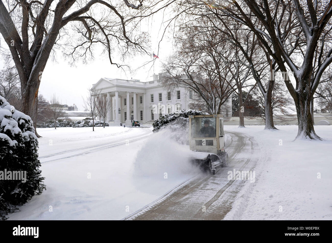 A Park Service Employee Drives A Snow Blower As He Clears Snow From A Walkway In Front Of The White House In Washington On March 2 09 A Late Winter Snow Storm A Park Service Employee Drives A Snow Blower As He Clears Snow From A Walkway In Front Of The White House In Washington On March 2 09 A Late Winter Snow Storm