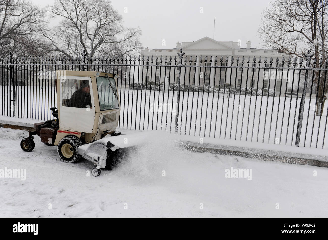 A Park Service Employee Drives A Snow Blower As He Clears Snow From A Walkway In Front Of The White House In Washington On March 2 09 A Late Winter Snow Storm