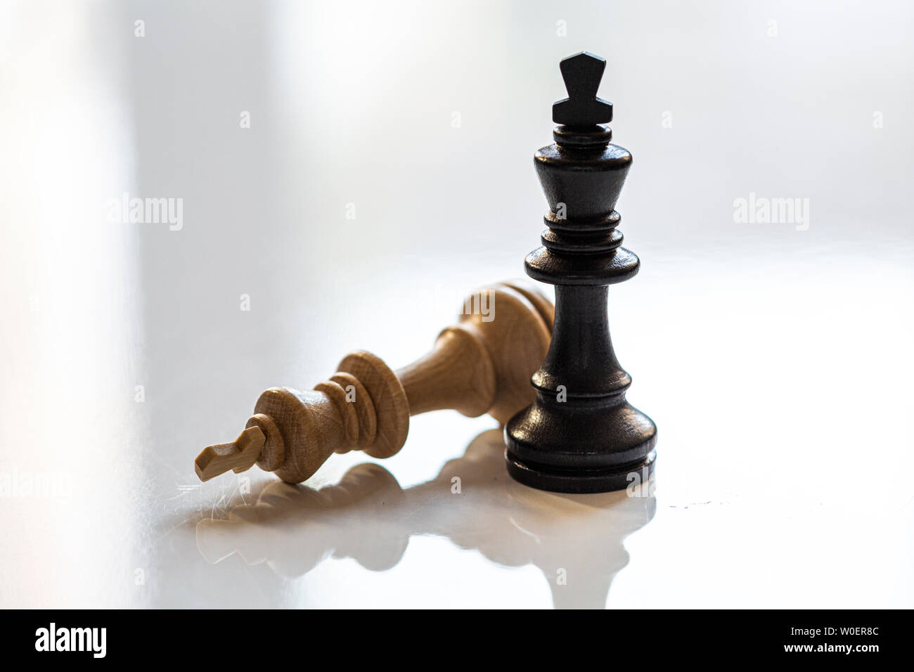 Queen and king chess pieces on white background Stock Photo - Alamy