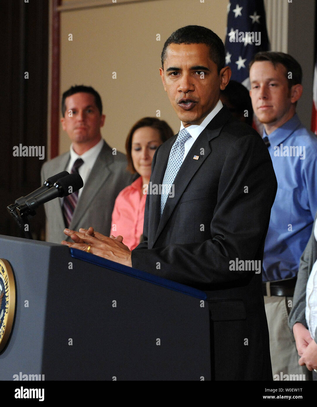 U.S. President Barack Obama speaks about Tax Day in the Eisenhower Executive Office Building adjacent to the White House on April 15, 2009. Obama said his policies reduced taxes for 95 percent of Americans and that in the future he would seek to simplify the tax code and make it more fair. With him are members of working families.   (UPI Photo/Roger L. Wollenberg) Stock Photo