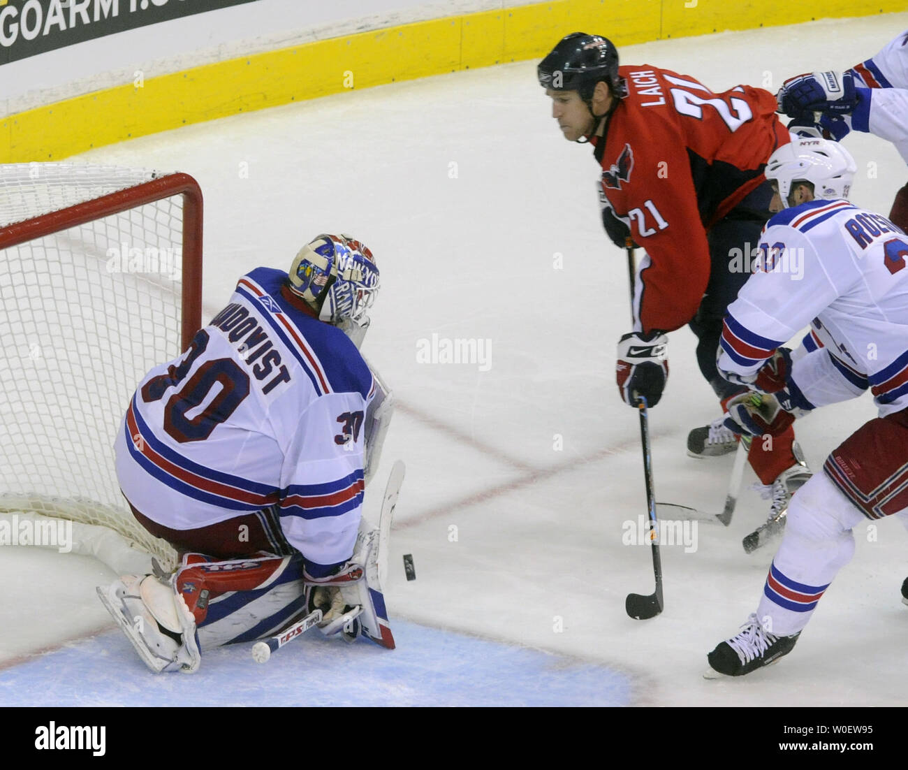 New York Rangers goaltender Henrik Lundqvist blocks a shot by ...